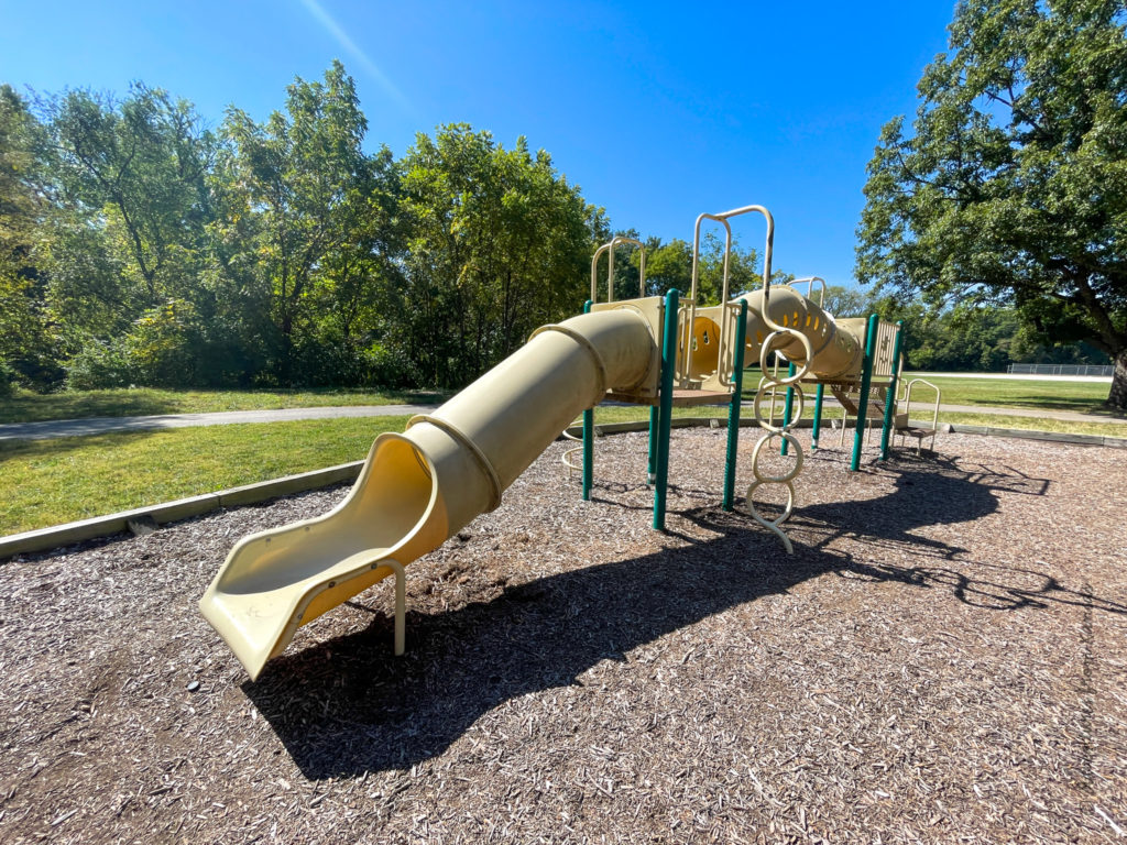 smaller playground near largest shelter with slides and tunnel