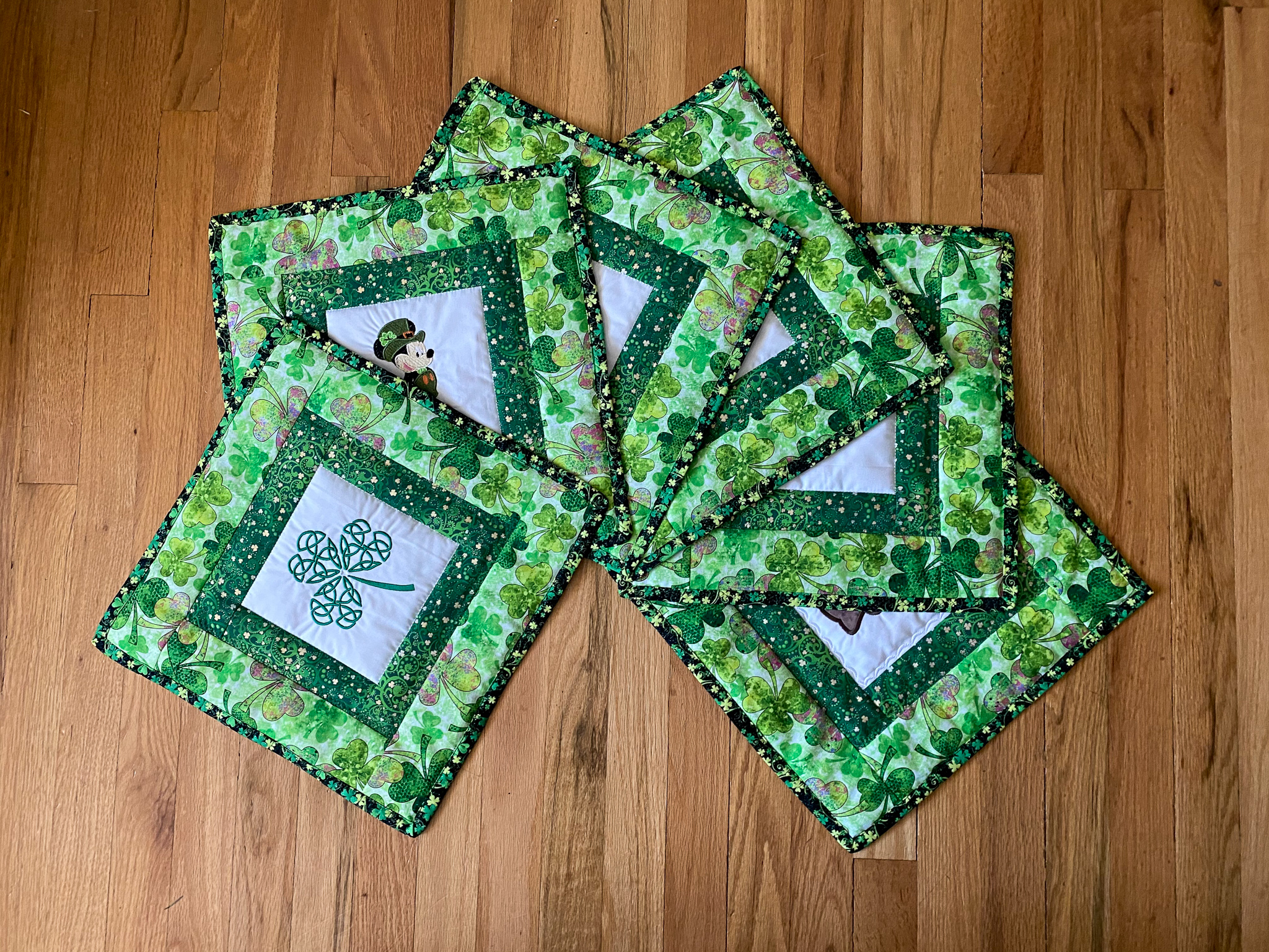embroidery shamrock on white and green placemat aray