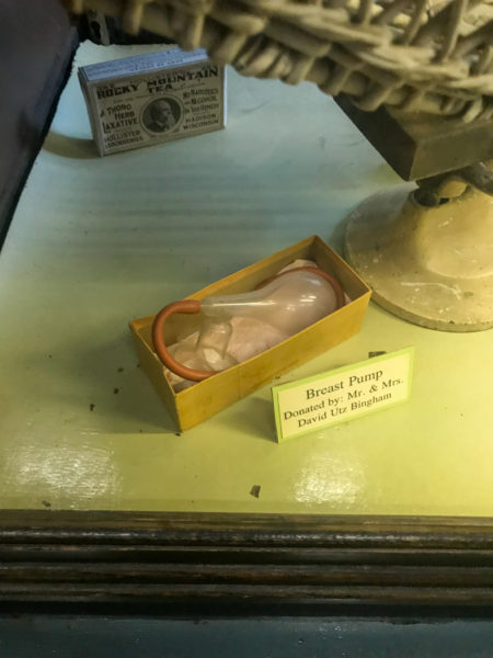 breast pump on display in the pharmacy section of the museum