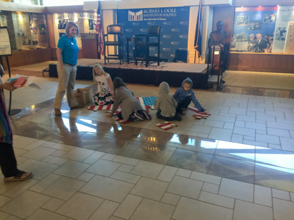 kids on floor working together on puzzle