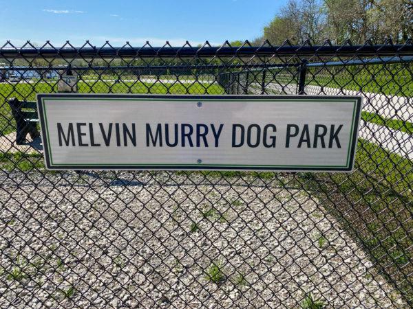Melvin Murry dog park sign on fence