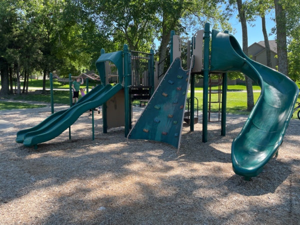 slide and rock wall at playground in lenexa