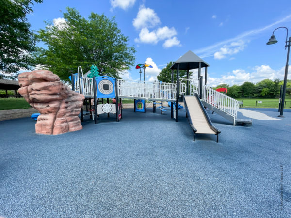 large roller slide and mountain on the playground in city park