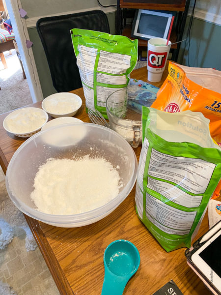 making bath salts, bowl, baking soda, epson salts, and measuring cup