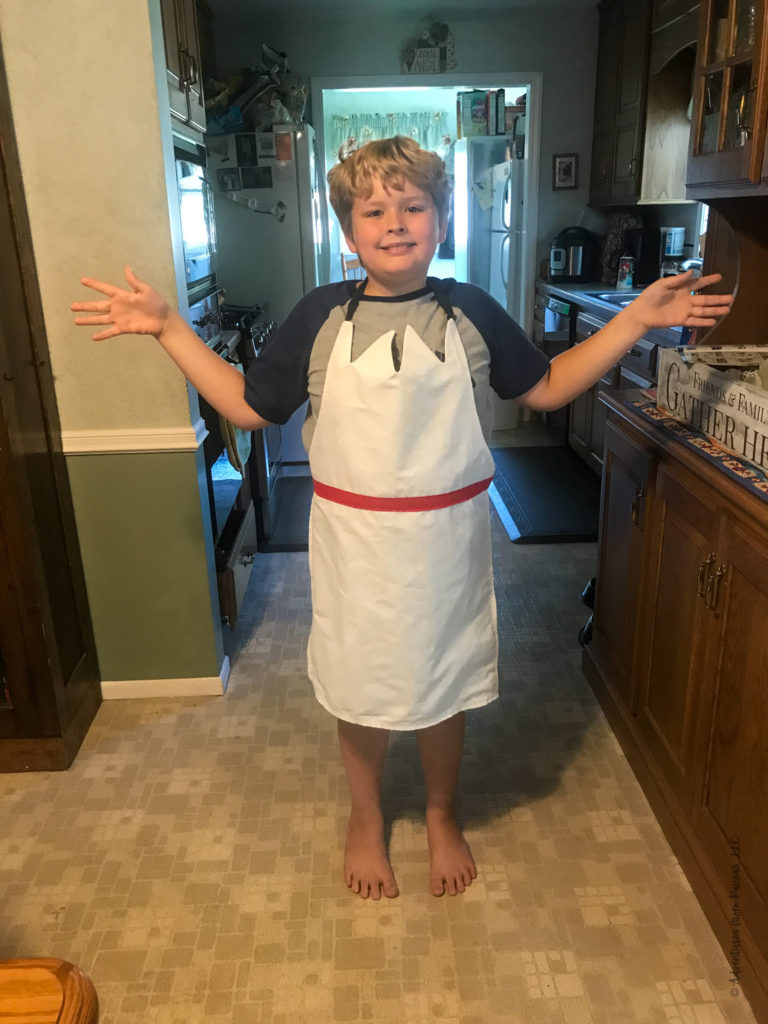 boy wearing Forky Apron