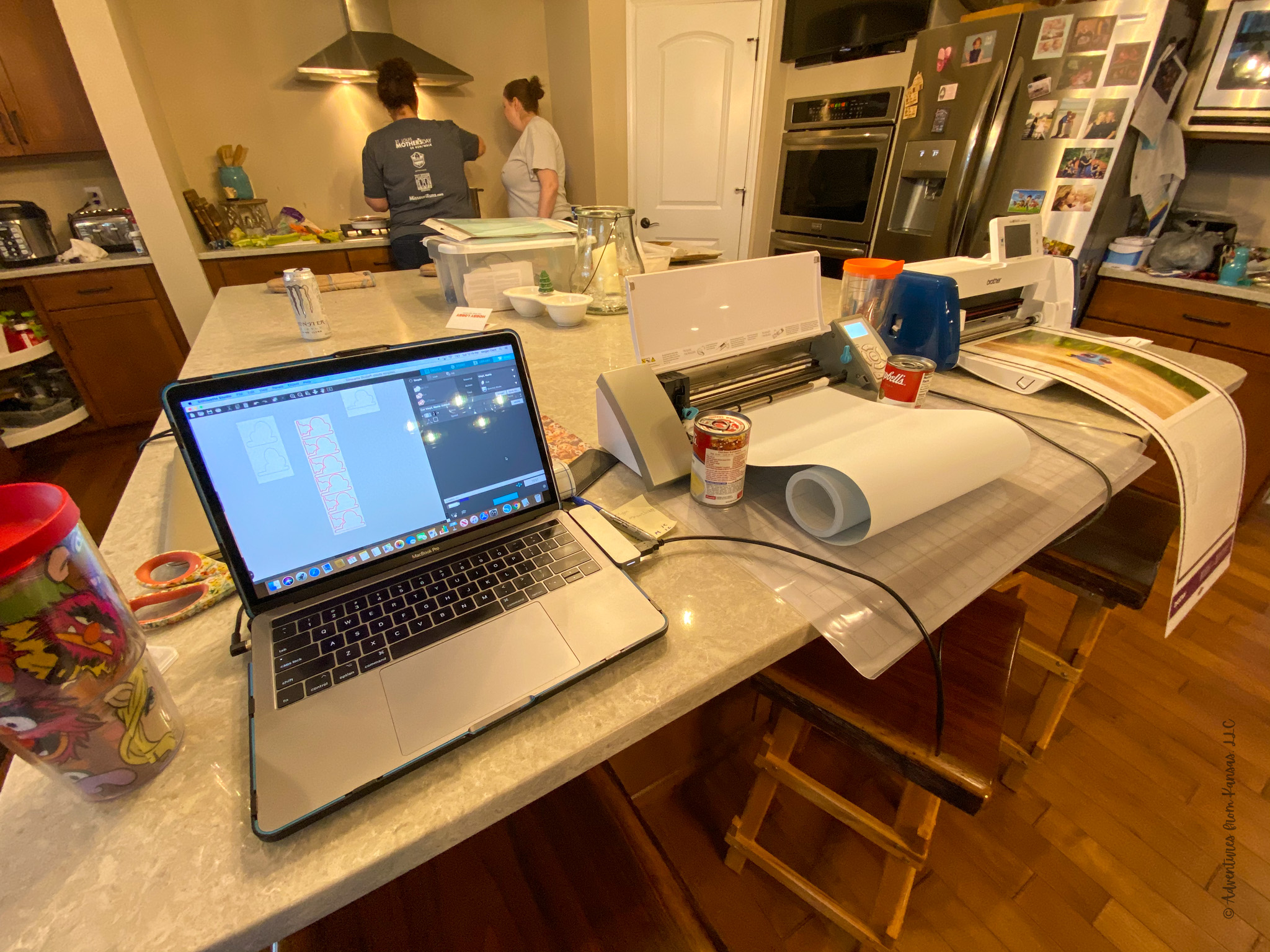 laptop and cutting machine on an island working
