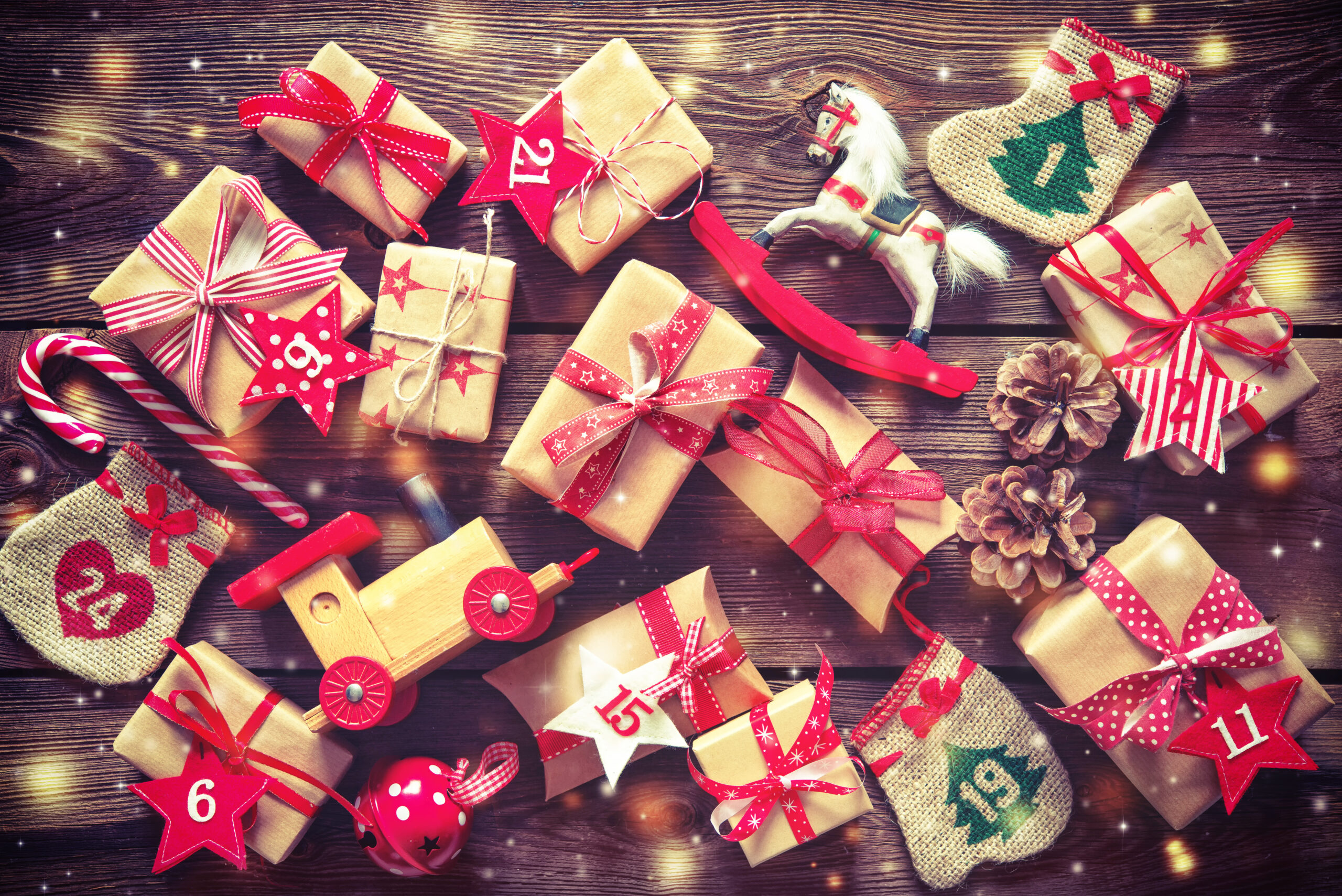 wood background with toys and presents with numbers for advent calendar