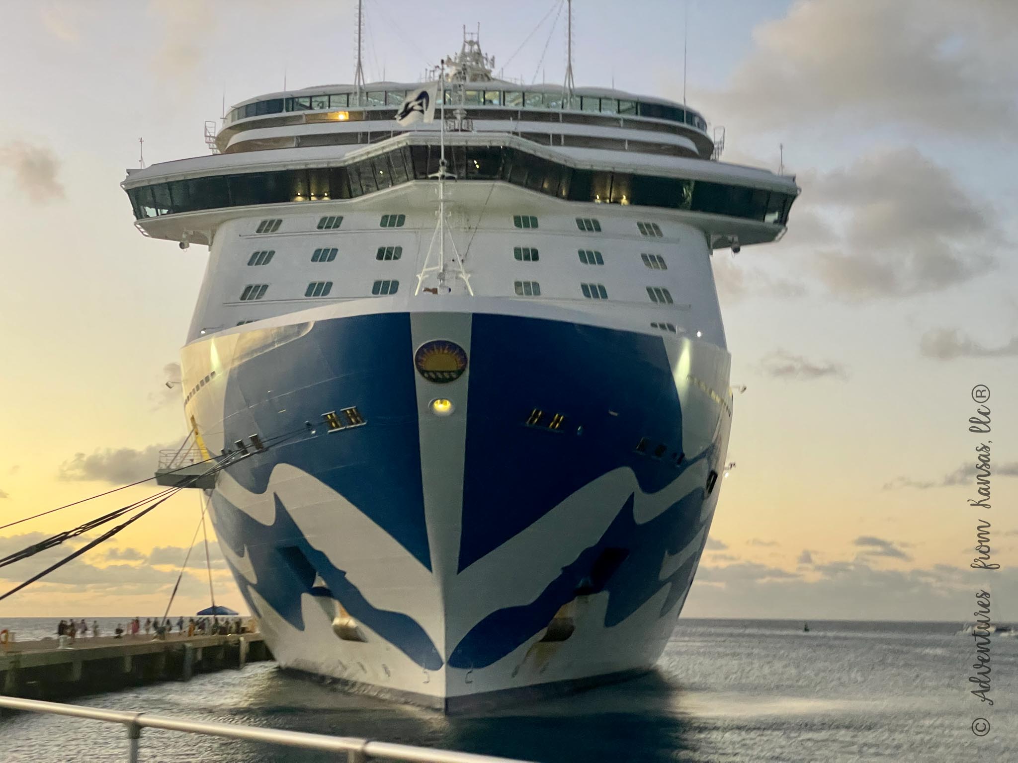 Regal princess ship front of the ship while docked sitting on water