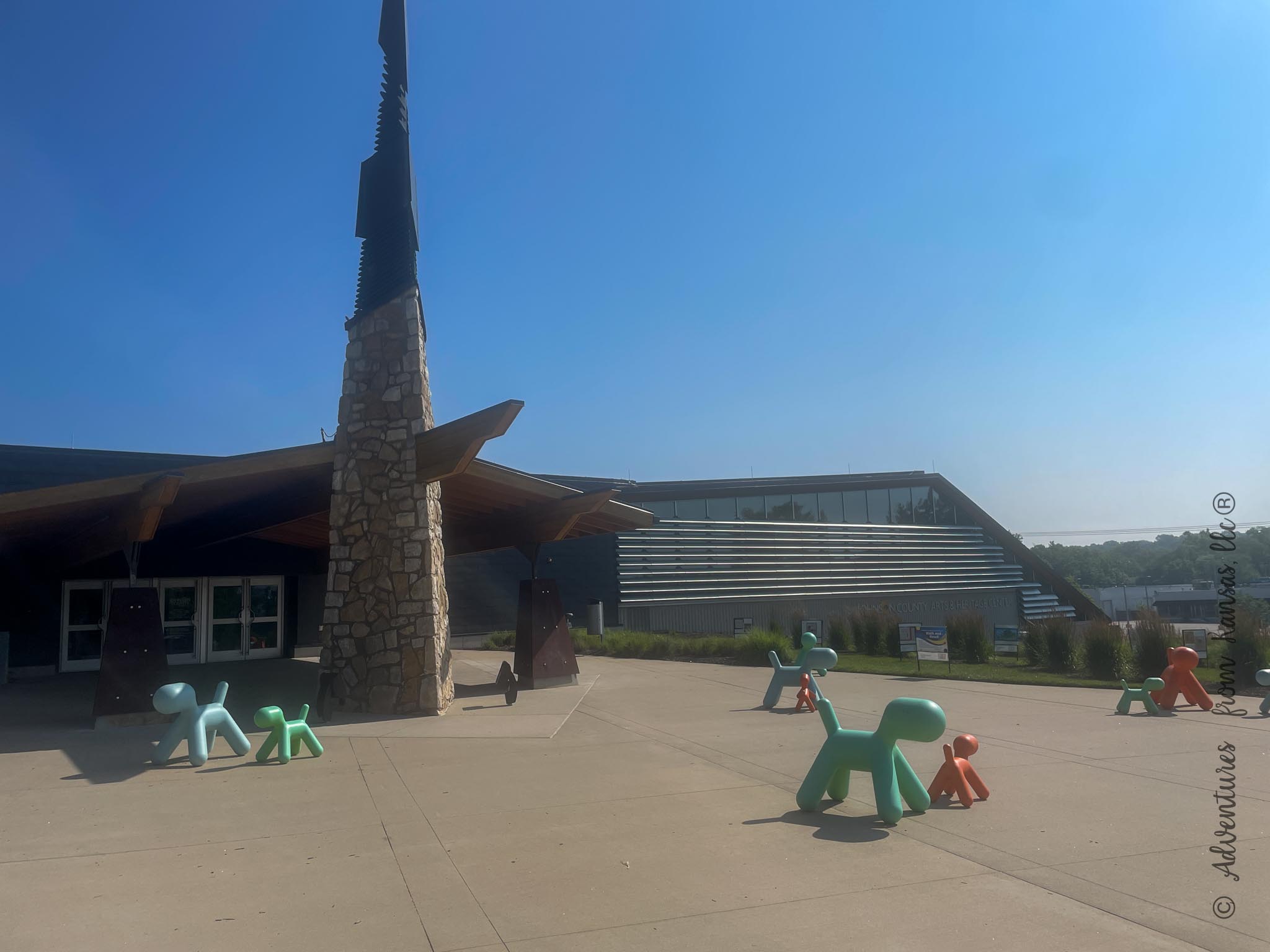 outside of the Johnson Country art and Hertiage museum that holds the museum and outside has dog balloon animals