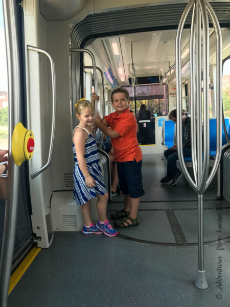 kids on the downtown Kansas City street car that is free to ride that goes from city market to union station